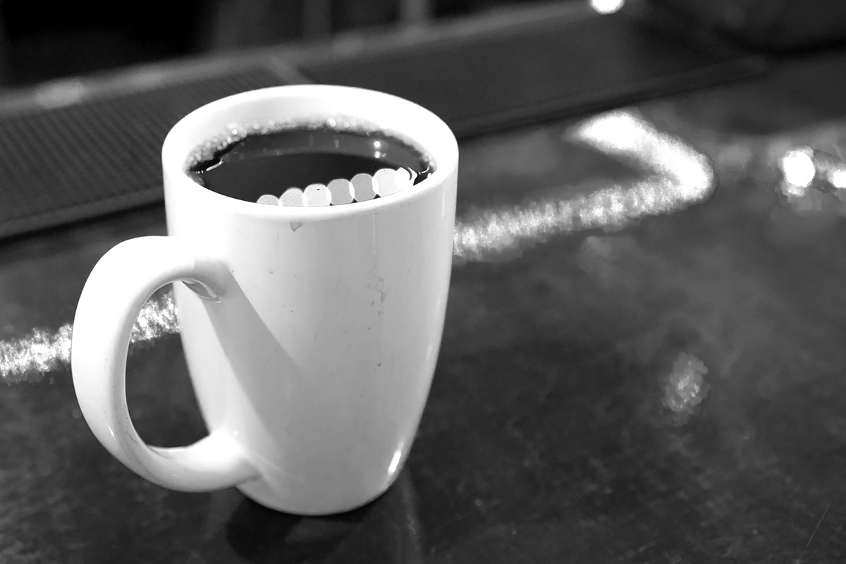 a cup of coffee on a cafe bar
