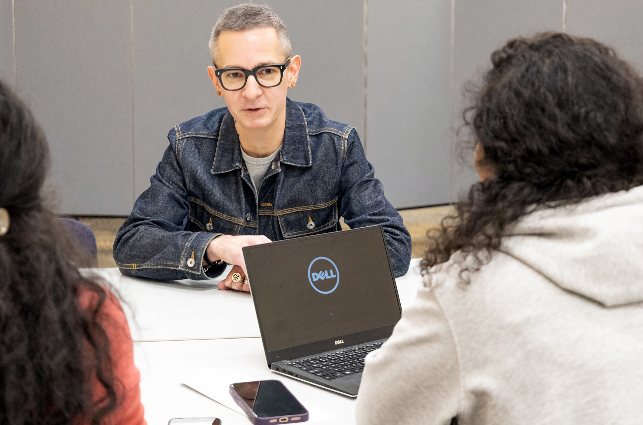 Justin Dauer chatting with clients